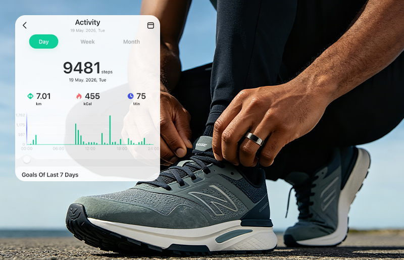 Runner tying shoes while wearing Vanberray Smart Ring with activity monitoring app panel